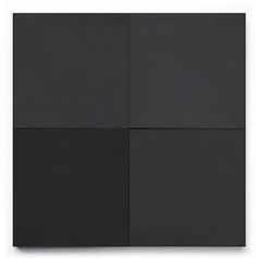 four square black tiles with white squares on them, all in different sizes and colors