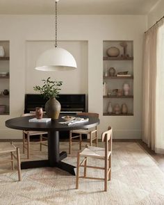 a dining room table with chairs around it