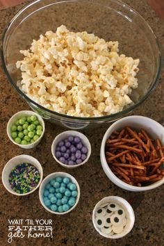 bowls filled with cereal, pretzels and candy