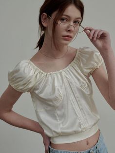 This is a modern and feminine top by SIEERING that is made out of high quality and sturdy material. With distinctive mood of the design and comfortable wear, you can style it for your casual daily outfit.- Sheer jacquard fabric with soft touch- Banding on the shoulder line- Feminine and romantic mood Feminine Silk Cream Top, Cream Silk Feminine Top, Feminine Cream Silk Top, Beige Silk Tops For Daywear, Silk Puff Sleeve Tops, Silk Puff Sleeve Padded Blouse, Feminine Cream Puff Sleeve Top, Feminine Beige Padded Blouse Top, Padded Feminine Blouse