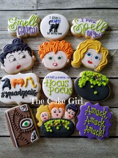 some cookies that are decorated to look like children's faces and words on them