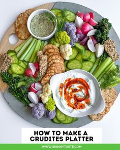 a platter filled with different types of vegetables and dips on top of it