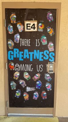 there is a sign on the door that says, there is greatness among us