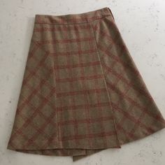 Gorgeous Vintage Banana Republic Wool Skirt. A-Line With Awesome A-Symmetrical Pleated Detailing. Side Zip. Camel Color With Pink/Red Plaid. Lined. 26” Length. Size 2. Never Worn! Offers Always Considered! Fitted Asymmetrical Beige Skirt, Fitted Beige Asymmetrical Skirt, Beige Fitted Asymmetrical Skirt, Beige Fitted Mini Wrap Skirt, Fitted Asymmetrical Brown Skirt, Brown Fitted Asymmetrical Skirt, Fitted Brown Asymmetrical Skirt, Fitted Asymmetrical Brown Mini Skirt, Brown Fitted Asymmetrical Mini Skirt