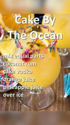 a cake by the ocean cocktail with sprinkles and orange slices on it