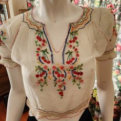 This Is An Authentic Hungarian Vintage Embroidered Muslin Blouse From The 1930s-1940s. It Is Rather Rare With The Cherry Embroidery. These Are Mostly Floral Embroidery Designs. They Were Made For The Tourist Market And Are All Hand-Embroidered. This One Is In Good Condition But It Does Have Some Flaws. (Remember, It's Almost 100 Yrs Old!) Some Of The Floss Is Pulled On Front; There Is A Repair Under The Armpit; The Elastic Is Stretched Out On Bottom Hem And The Snap Front Is Very Worn, The Snap Is Literally Hanging By A Thread. (I Would Wear It Open Anyway; It Looks Better!) I Have Shown All Of The Flaws In Photos But Feel Free To Ask For More Photos. Now, The One Drawback Is This Blou Embroidery Patterns For Blouses, Embroidered Peasant Blouse, Mexican Embroidered Blouse, Raya Core, Hungarian Clothing, Muslin Blouse, Floral Embroidery Designs, Hanging By A Thread, Cherry Embroidery