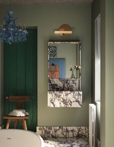 a bath room with a tub and a mirror on the wall next to a chair