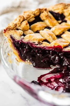 a close up of a pie with blueberry sauce on it's crusts