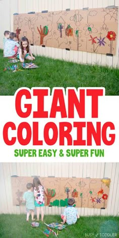 the giant coloring book for kids is on display in front of a wooden fence and grass area