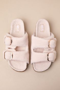 From slow Sundays to busy airport moments, the MIA Qianna Natural Shearling Buckle Platform Slide Sandals will keep you cute and comfy! Soft and fuzzy faux fur shapes these trendy slides with a rounded-toe footbed and wide, adjustable vamp straps with shiny gold buckles (atop a 1"" toe platform). The simple slide-on design boasts a 1.75"" contoured, platform cork sole that completes the perfectly chunky look. 1. 75" contoured platform sole. Cushioned insole. Rubber sole has nonskid markings. Man Made Materials. Imported. Lulus | Qianna Natural Shearling Buckle Platform Slide Sandals | Size 7.5. Trendy Slides, Platform Slide Sandals, What Is Trending Now, Platform Slides, Dresses Shoes, Shoes For Women, Slide Sandals, Style Fashion, Rubber Sole