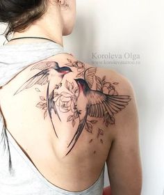 a woman with a bird tattoo on her back