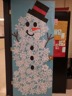 a door decorated to look like a snowman