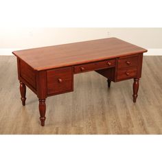 a wooden desk with two drawers on one side and an open drawer on the other