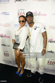 a man and woman posing on the red carpet at an event