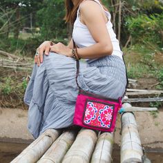 "This beautiful crossbody bag is made with an amazing hand embroidered piece of fabric by the Hmong hill tribes of Lanna Country (Northern Thailand). This bag is the perfect accessory to complete the look Great idea to grab your mini tablet, cell phone and your items in one stylish bag. adding convenience for your daily adventures. We buy materials from Hmong market and we design and sew by hand. Some of the bags we modify to improve the product. The Hmong tribes live in the North of Thailand an Traditional Embroidered Pink Shoulder Bag, Traditional Pink Embroidered Shoulder Bag, Traditional Pink Shoulder Bag, Pink Embroidered Crossbody Shoulder Bag, Pink Floral Embroidered Travel Bag, Bohemian Crossbody Bag With Floral Embroidery, Boho Wallet, Artisan Bag, Mini Tablet