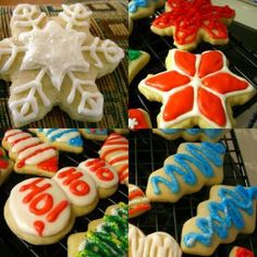 decorated christmas cookies sitting on top of a cooling rack