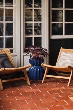 Create an inviting front porch with cozy fall decor. Style woven wood accent chairs with neutral-hued pillows for a relaxed vibe. Add a glossy blue accent table for a pop of color and a terracotta planter filled with autumn plants boasting deep purple leaves for a seasonal touch.

Shop for your home at Birch Lane. Wood Accent Chairs, Blue Accent Table, Autumn Plants, Purple Leaves, Cozy Fall Decor, Woven Wood, Blue Accent, Terracotta Planter, Wood Accent