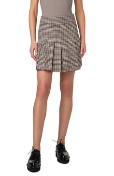 A professorial houndstooth plaid gets its untailored reputation elegantly countered by the polished cut of this skirt flared at the front by box pleats. Hidden back-zip closure 100% virgin wool Dry clean Made in Romania Designer Clothing Tweed Pleated Skirt For Work, Fall Business Casual Pleated Skirt, Fitted Tweed Pleated Skirt, Fall Fitted Skirt With Houndstooth Pattern, Plaid Pleated Skirt For Workwear In Fall, Plaid Pleated Skirt For Work, Plaid Skirt For Work In Fall, Plaid Skirt For Fall Workwear, Wool Pleated Skirt