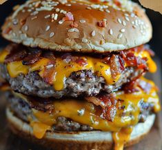 a cheeseburger with bacon and other toppings