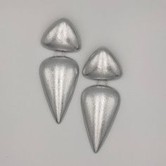 Modern Metal Teardrop Earrings For Pierced Ears, Modern Metal Dangle Clip-on Earrings, Silver Teardrop Metal Clip-on Earrings, Modern Metal Teardrop Earrings For Party, Trendy Silver Teardrop Metal Earrings, Minimalist Silver Clip-on Earrings For Party, Modern Silver Teardrop Clip-on Earrings, Silver Metal Clip-on Earrings For Party, Modern Silver Metal Earrings