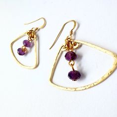 Amethysts swing inside golden fans, their hammered contours creating the illusion of antique elegance. They would be a beautiful addition to any boho outfit or Elegant Hammered Jewelry For Festivals, Boho Outfit, Fan Earrings, Phoenix Az, Boho Outfits, Jewelry Earrings Dangle, Phoenix, Etsy Earrings, Dangle Drop Earrings