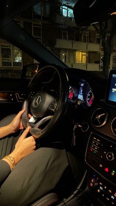 the interior of a car with an electronic display on the dash board and steering wheel