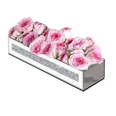 a white box with pink roses in it