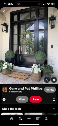 the front door is decorated with potted plants and an entry mat that says, gray and pat phillips