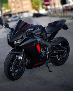 a black motorcycle parked on the side of a road