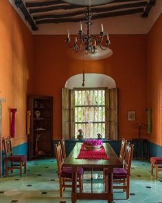 the dining room is decorated in vibrant colors