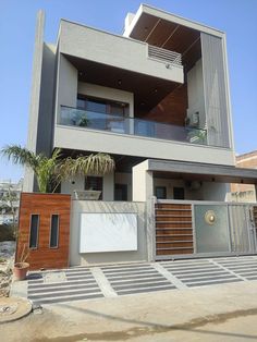 a modern house with an attached balcony and balconies