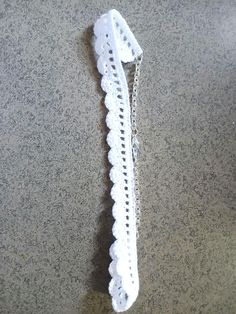 a white piece of lace sitting on top of a counter