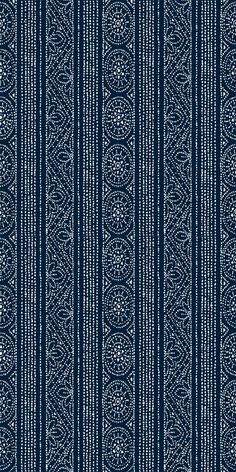 a blue and white striped wallpaper with an intricate design on the bottom half of it