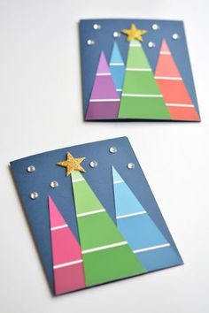 two christmas trees made out of colored paper