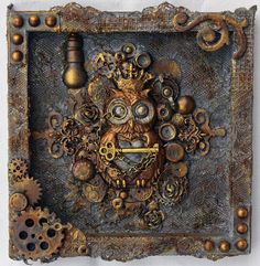 an intricately designed metal box with gears and a mechanical owl on it's face