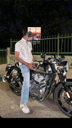 a man sitting on top of a motorcycle