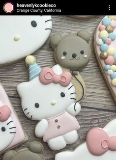 hello kitty cookies are arranged on a table