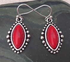 Red howlite stone earrings.  Set in an antique silver plated bezel frame with fun accents that help accentuate the centerpiece.These are lightweight and comfortable to wear.  They hang from a simple sleek silver ear wire hook.  All made from allergy free materials.  Earrings measurements are, 1/2” wide by 7/8” long.  Overall drop length is about 1”.I have a matching necklace in my Etsy shop if you would like the whole set.  Here is the link............... https://etsy.me/2WKmoCF I have this same Vintage Red Sterling Silver Earrings, Southwestern Style Red Dangle Earrings, Red Vintage Sterling Silver Earrings, Southwestern Red Drop Earrings, Red Southwestern Dangle Earrings, Southwestern Red Dangle Earrings, Red Stone Earrings, Southwestern Style Red Nickel-free Earrings, Bohemian Red Nickel-free Chandelier Earrings