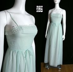 "Lovely Vintage 70s Light Minty Green Cotton Maxi Dress with Pretty White Trim Please note that colors can vary from screen to screen, and in real life.  Mannequin was too small for dress, so that is why it is not zipped up all the way.. zipper works fine! Lined. Bust 15\" (laid flat) Waist 12\" (laid flat)  Hip 16.5\" (laid flat)  Length, Top to Bottom 57\" Bottom Opening 41\" (laid flat)  Tag: House of Bianchi, Boston New York / 8 Condition: 2 Condition Scale:  1-Immaculate Vintage Condition ( 70’s Dresses, 60s 70s Fashion, Cotton Maxi Dress, Minty Green, Cotton Maxi, Maxi Dress Cotton, Long Scarf, White Trim, Vintage Wear