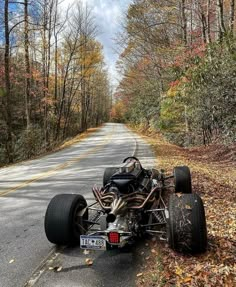 a car that is sitting on the side of the road with it's front wheels down