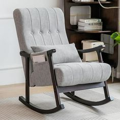 a gray rocking chair with a black frame