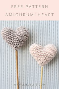 two knitted heart lollipops with the text free pattern amigurmi heart