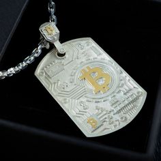 This is a BTC silver necklace with gold plating.  The necklace is made using high-precision machines and manual labor, it is truly a high-quality and detailed piece of jewelry for connoisseurs. After placing the order, the manufacturing will be started no later than the next workday, and will be completed 10-12 days after purchasing, this does not include the time required for shipping. Dimensions length - 47mm width-25mm chain length 50 cm MANUFACTURING TIME The manufacturing time is usually between 10-12 workdays.  Delivery time is about 2-3 Weeks (via national mail) , except any delay by customs hold, public holidays, flight delay, weather, strike etc We will send your order within 1-3 working days after it is ready. We will NOT be responsible for any delay during delivery including cus Luxury Engraved Chain Necklace As Gift, Luxury Engraved Chain Necklace For Gift, Engraved White Gold Metal Necklaces, White Gold Engraved Metal Necklaces, Silver Dog Tag Chain Necklace Gift, Etched White Gold Necklaces For Anniversary, Luxury Silver Dog Tag Jewelry, Engraved White Gold Dog Tag Necklace, White Gold Dog Tag Necklaces For Gift