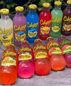 several bottles of calories are lined up on a table