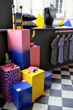 an artistic display in a store filled with colorful boxes