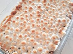 a casserole dish with marshmallows on top