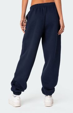 Online Only! Dive into ultimate coziness with Edikted's Clark Oversized Sweatpants. Stay on-trend with the perfect blend of comfort and style, featuring an elastic stretch waistline, oversized fit, elasticated hem, and convenient side pockets. Elevate your loungewear game and achieve maximum comfort without compromising on fashion with these must-have oversized sweatpants.   	Elastic stretch waistline 	Side pockets 	Oversized fit 	Cotton, Polyester 	Model wears size S 	Model height is 5'9 Navy Blue Brandy Melville Sweatpants, Navy Sweatpants Outfit, Navy Blue Sweatpants Outfit, Sweatpants Oversized, Navy Blue Sweatpants, Navy Sweatpants, Cute Sweats, High School Fashion, Oversized Sweatpants