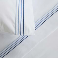 white sheets with blue stripes on them