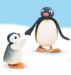 two small penguins standing next to each other