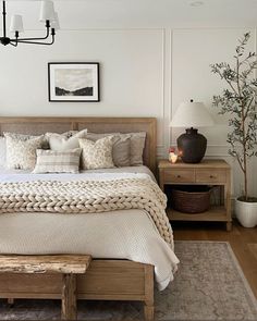 a bedroom with a large bed and wooden furniture